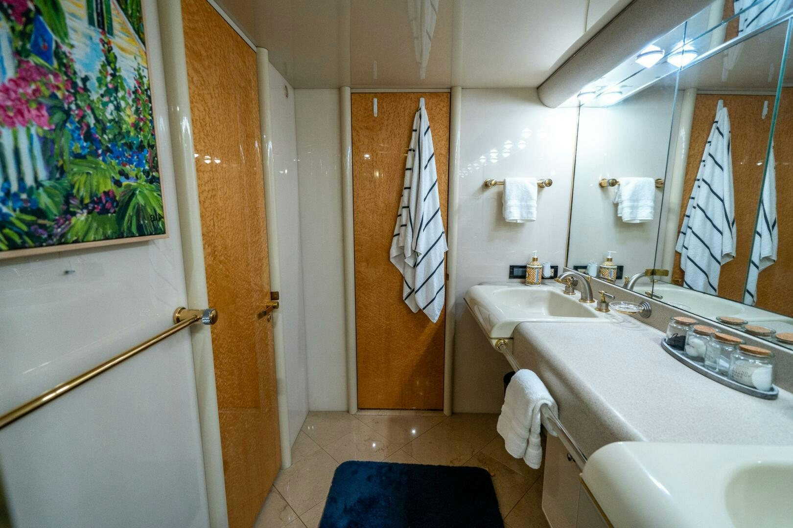 a bathroom with a sink and a mirror aboard PRESTIGE WORLDWIDE Yacht for Sale