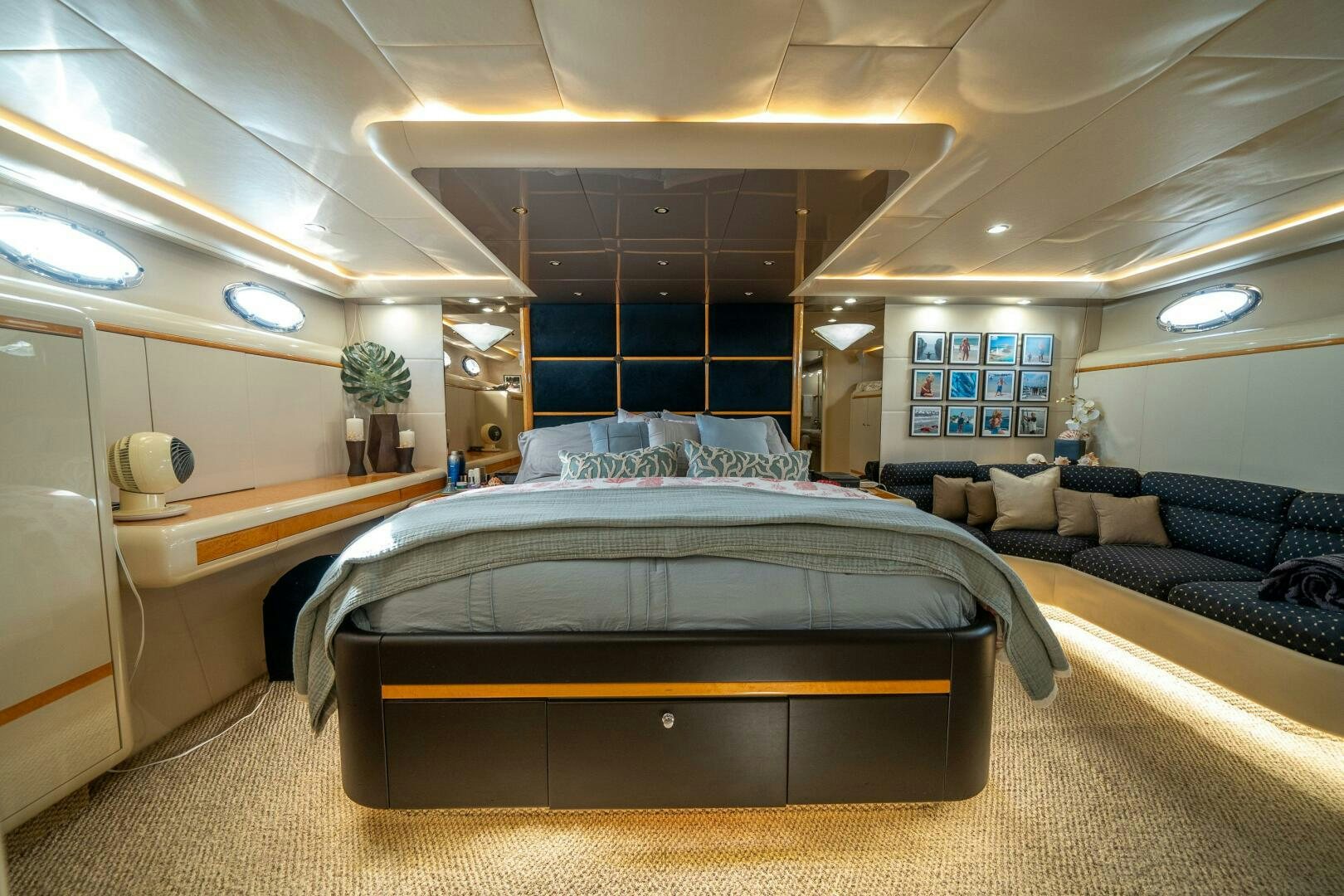 a room with a bed and a couch aboard PRESTIGE WORLDWIDE Yacht for Sale