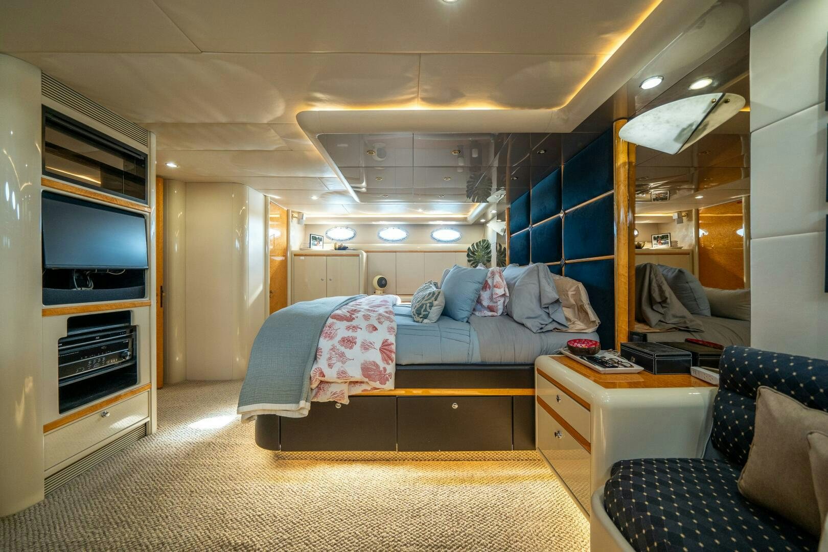 a room with a bed and a television aboard PRESTIGE WORLDWIDE Yacht for Sale