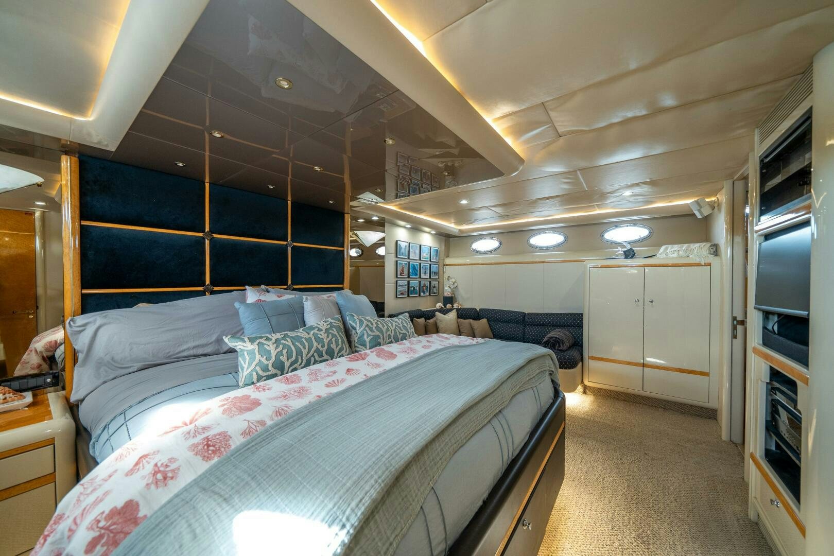 a bedroom with a bed and a closet aboard PRESTIGE WORLDWIDE Yacht for Sale