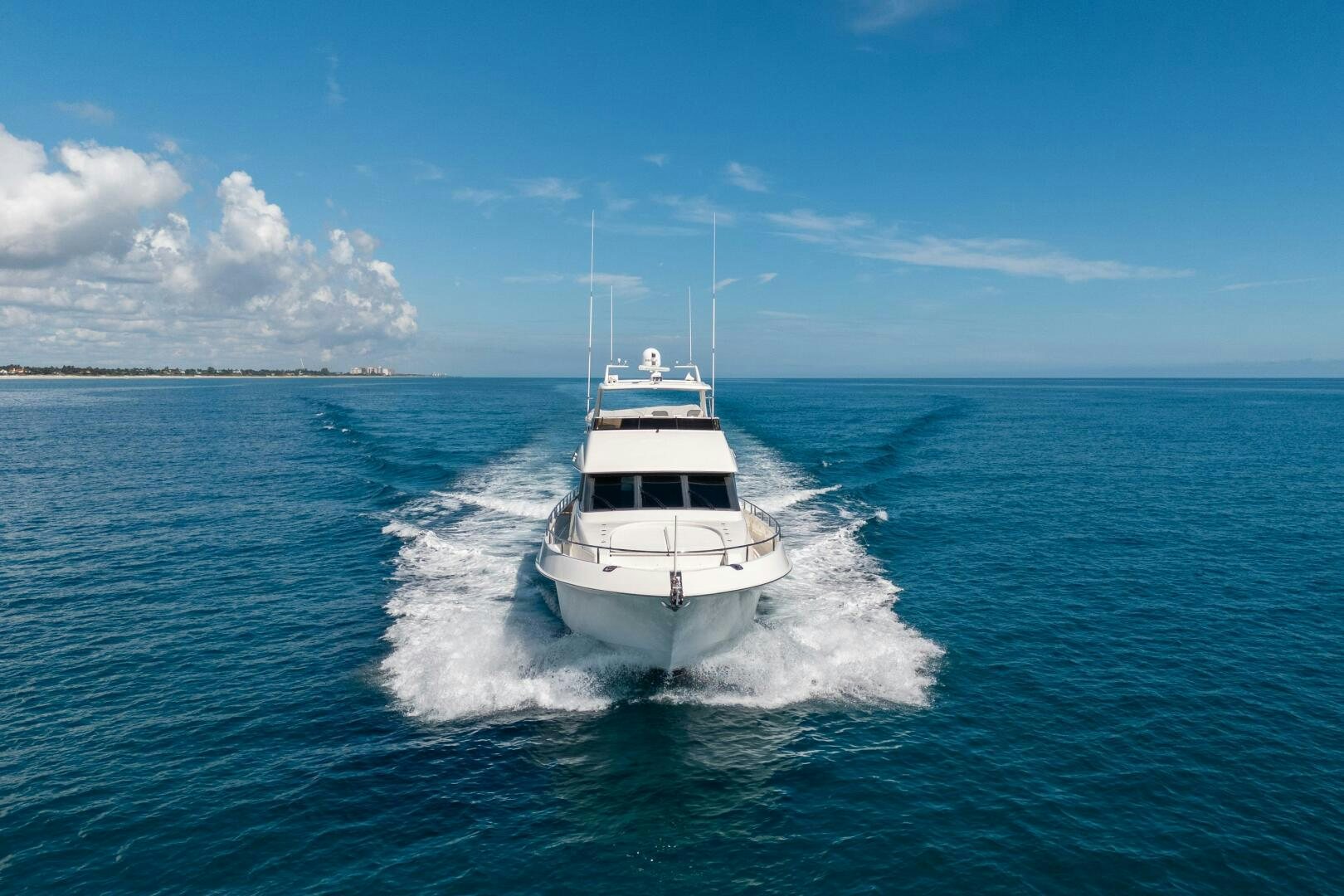 a boat on the water aboard PRESTIGE WORLDWIDE Yacht for Sale