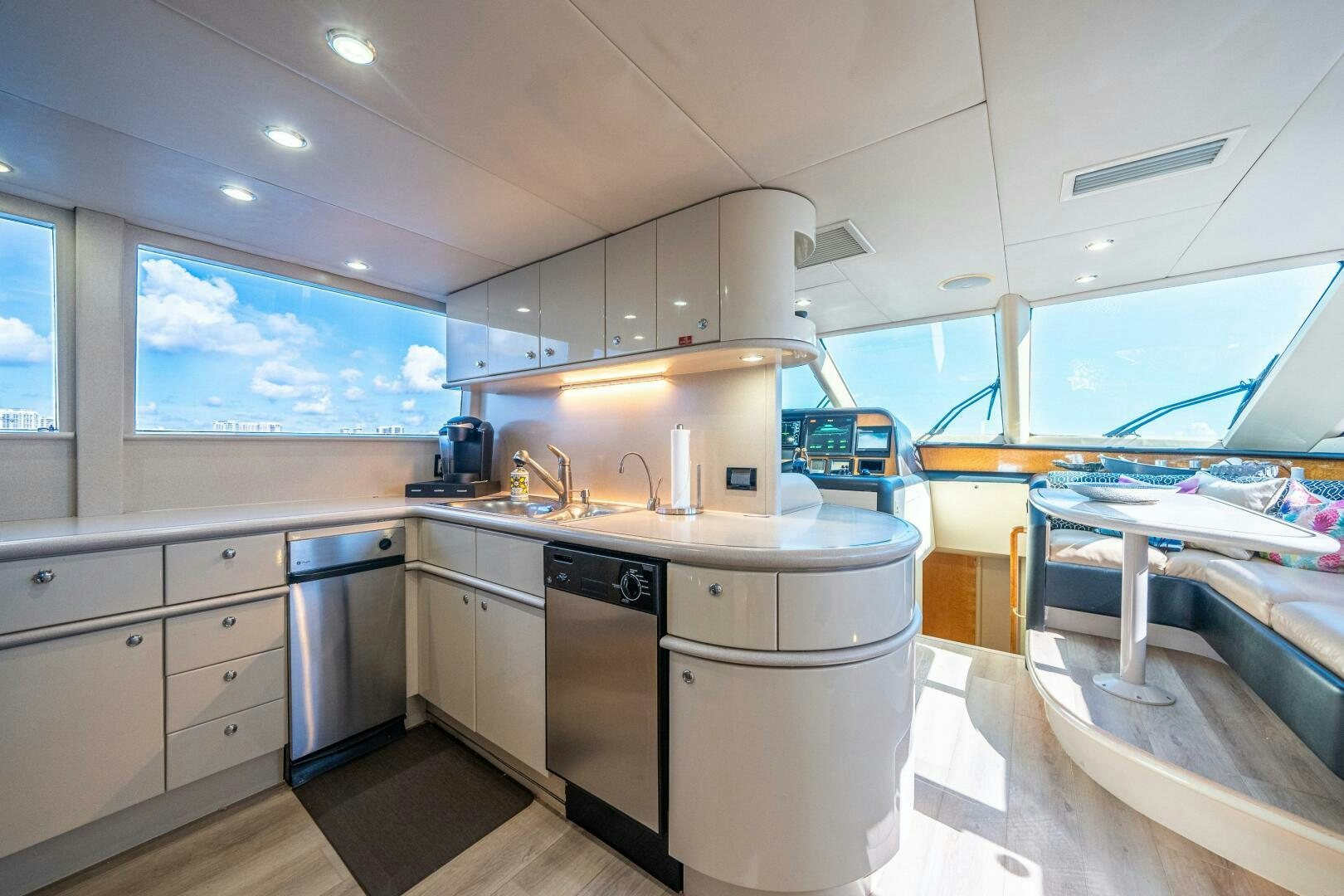 a kitchen with a large window aboard PRESTIGE WORLDWIDE Yacht for Sale