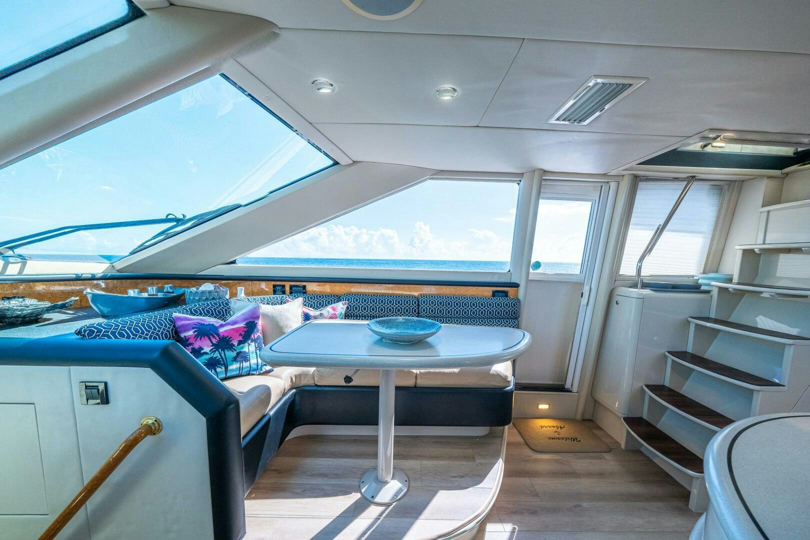 a boat with a table and chairs aboard PRESTIGE WORLDWIDE Yacht for Sale