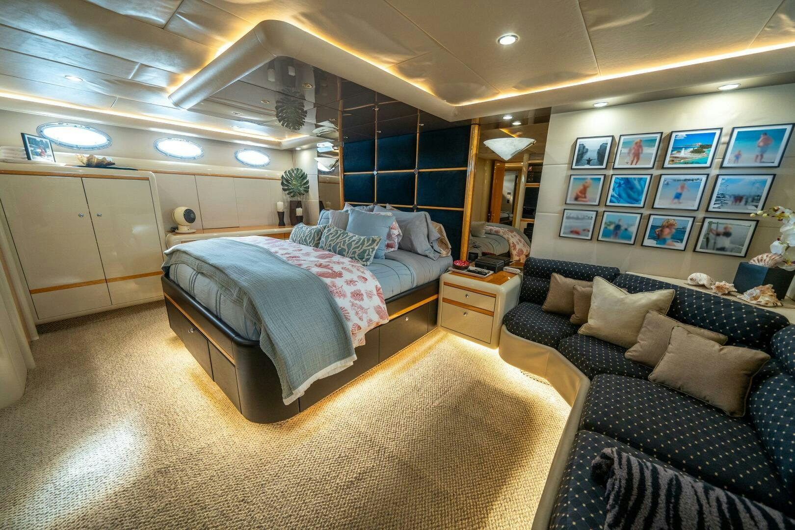 a bedroom with a bed and a couch aboard PRESTIGE WORLDWIDE Yacht for Sale