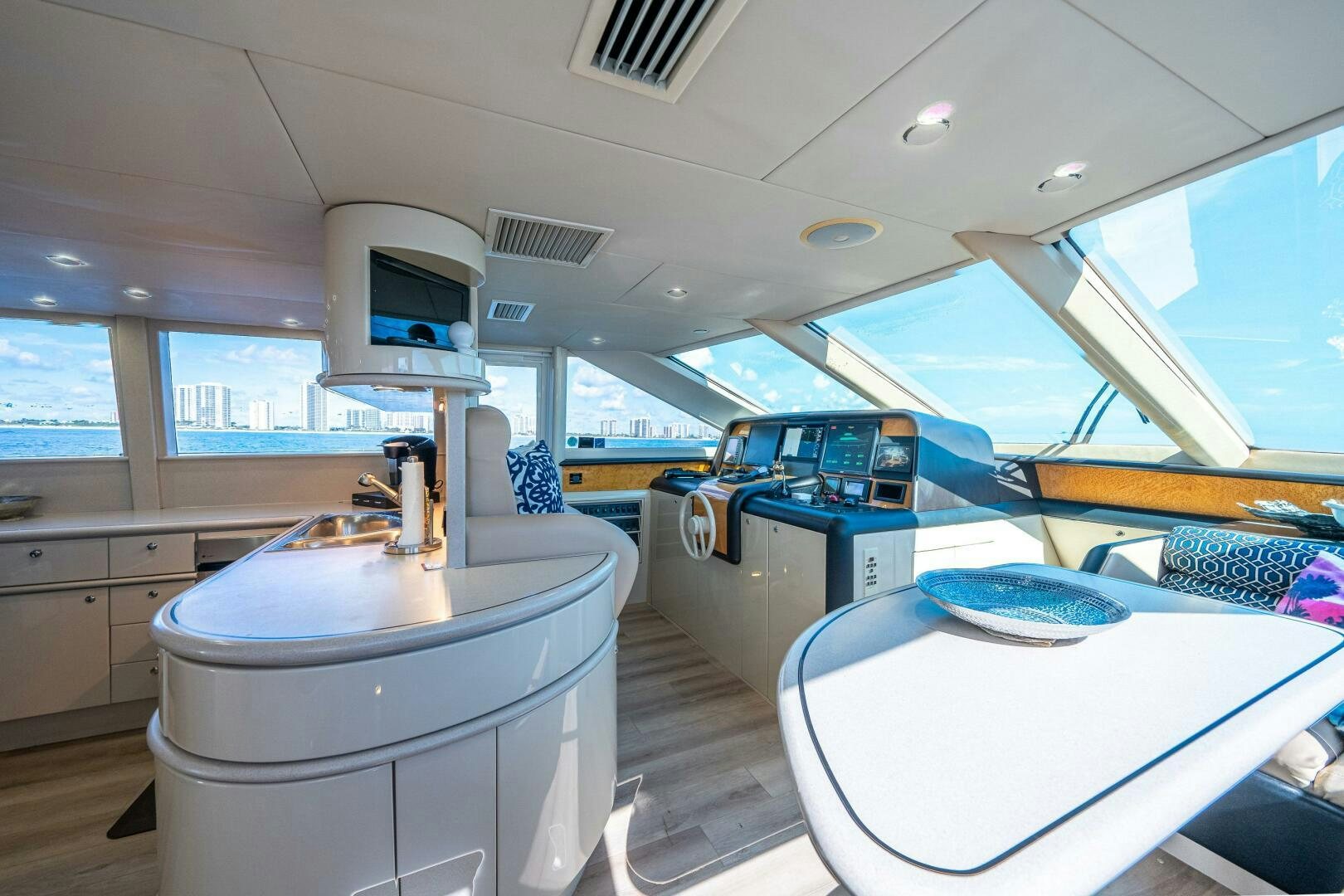 a room with a desk and a television aboard PRESTIGE WORLDWIDE Yacht for Sale
