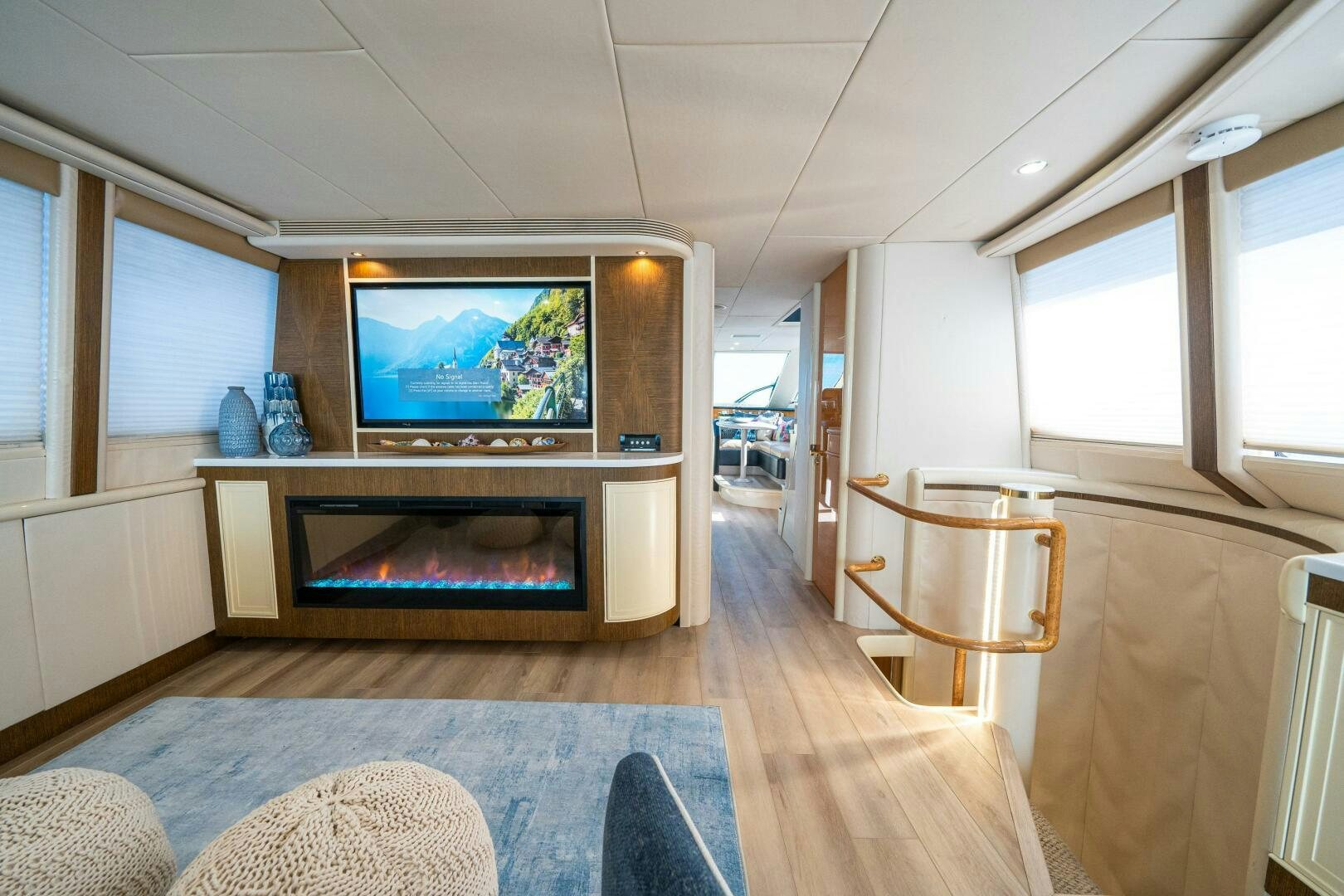 a living room with a large television aboard PRESTIGE WORLDWIDE Yacht for Sale