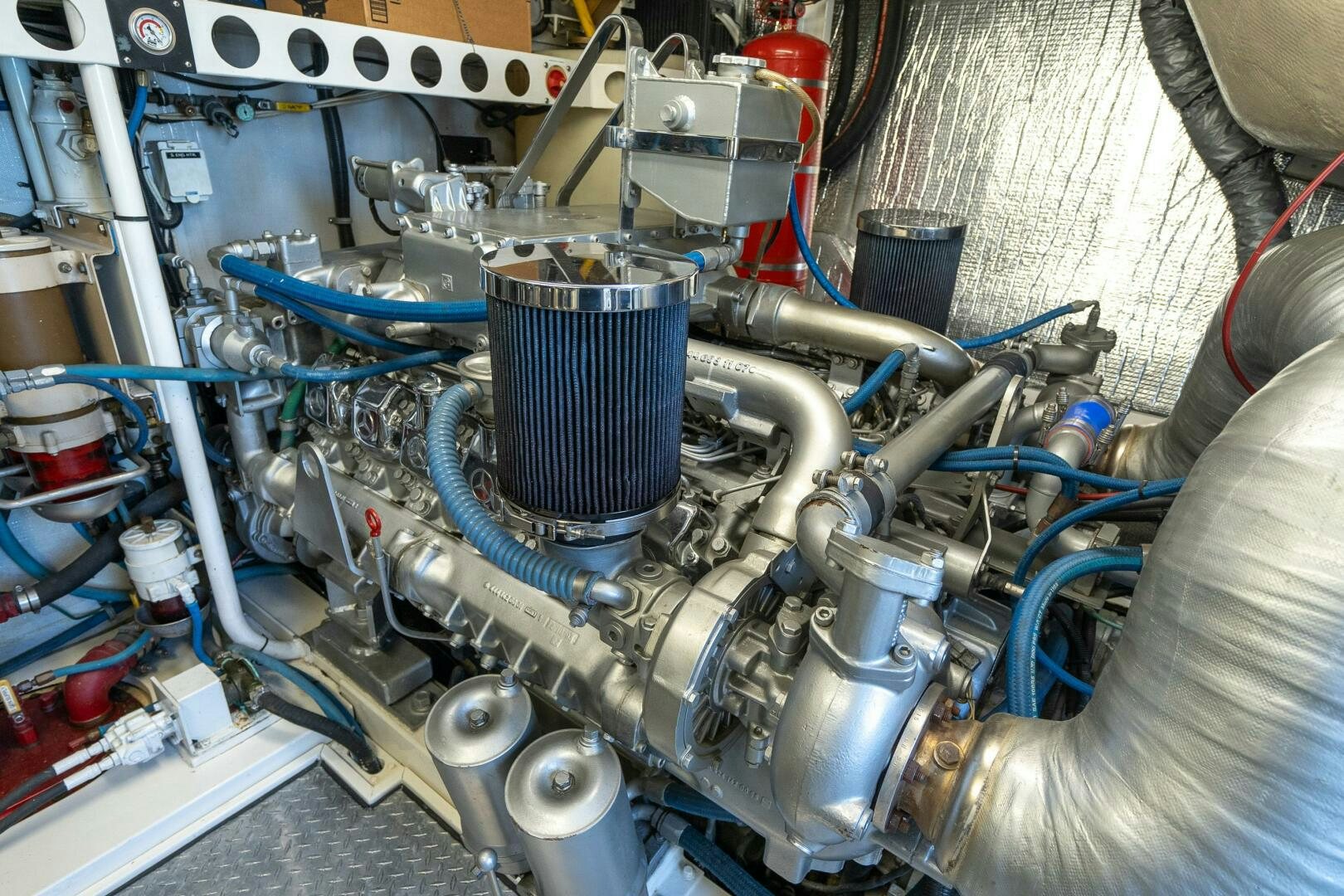 a machine with a blue engine aboard PRESTIGE WORLDWIDE Yacht for Sale