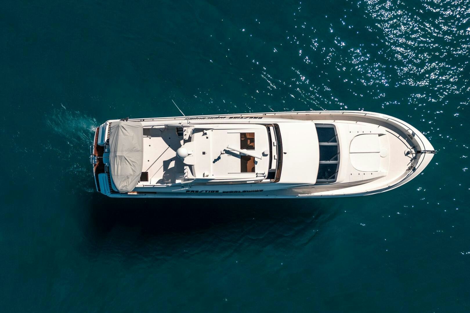 a boat in the water aboard PRESTIGE WORLDWIDE Yacht for Sale