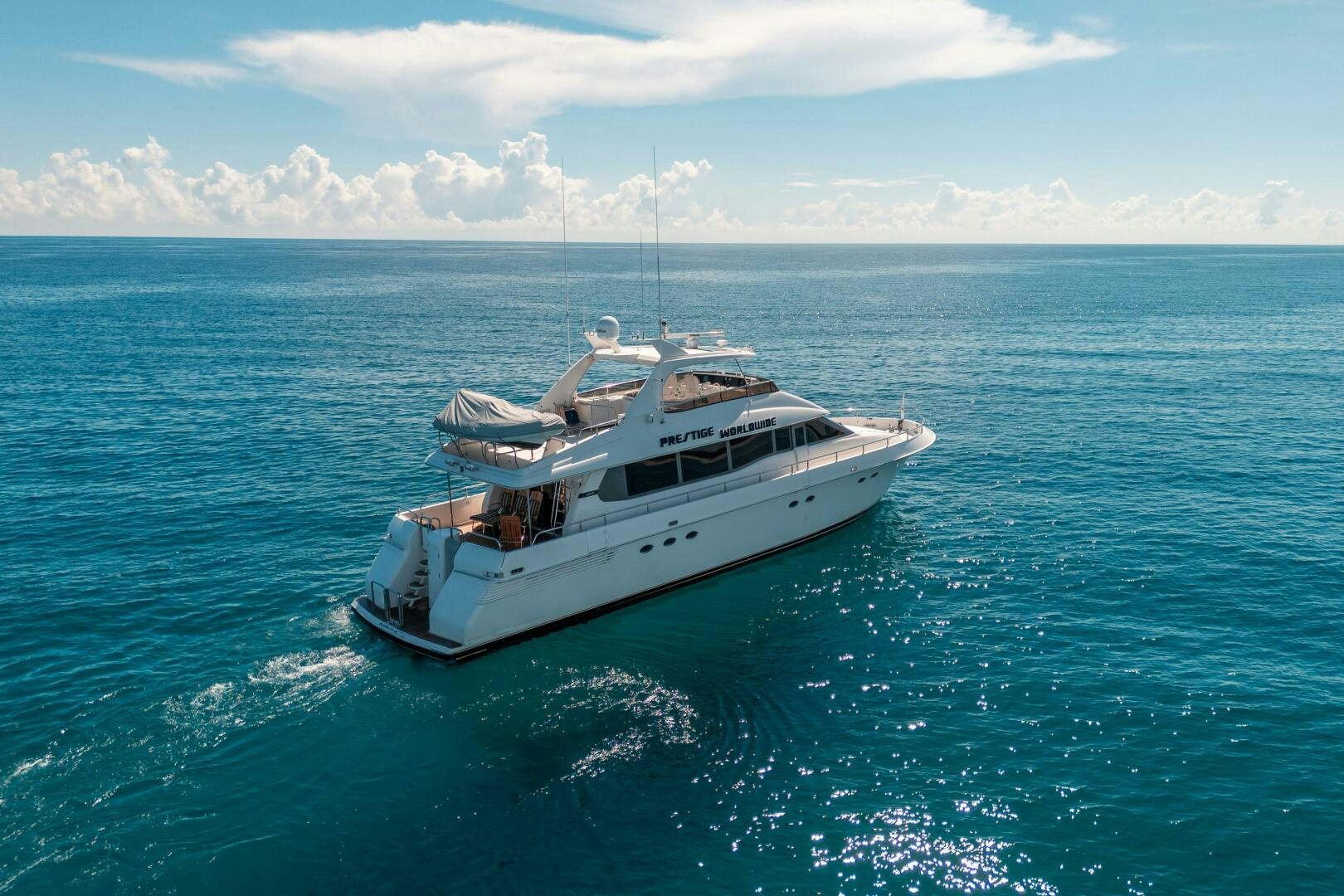 a boat in the water aboard PRESTIGE WORLDWIDE Yacht for Sale