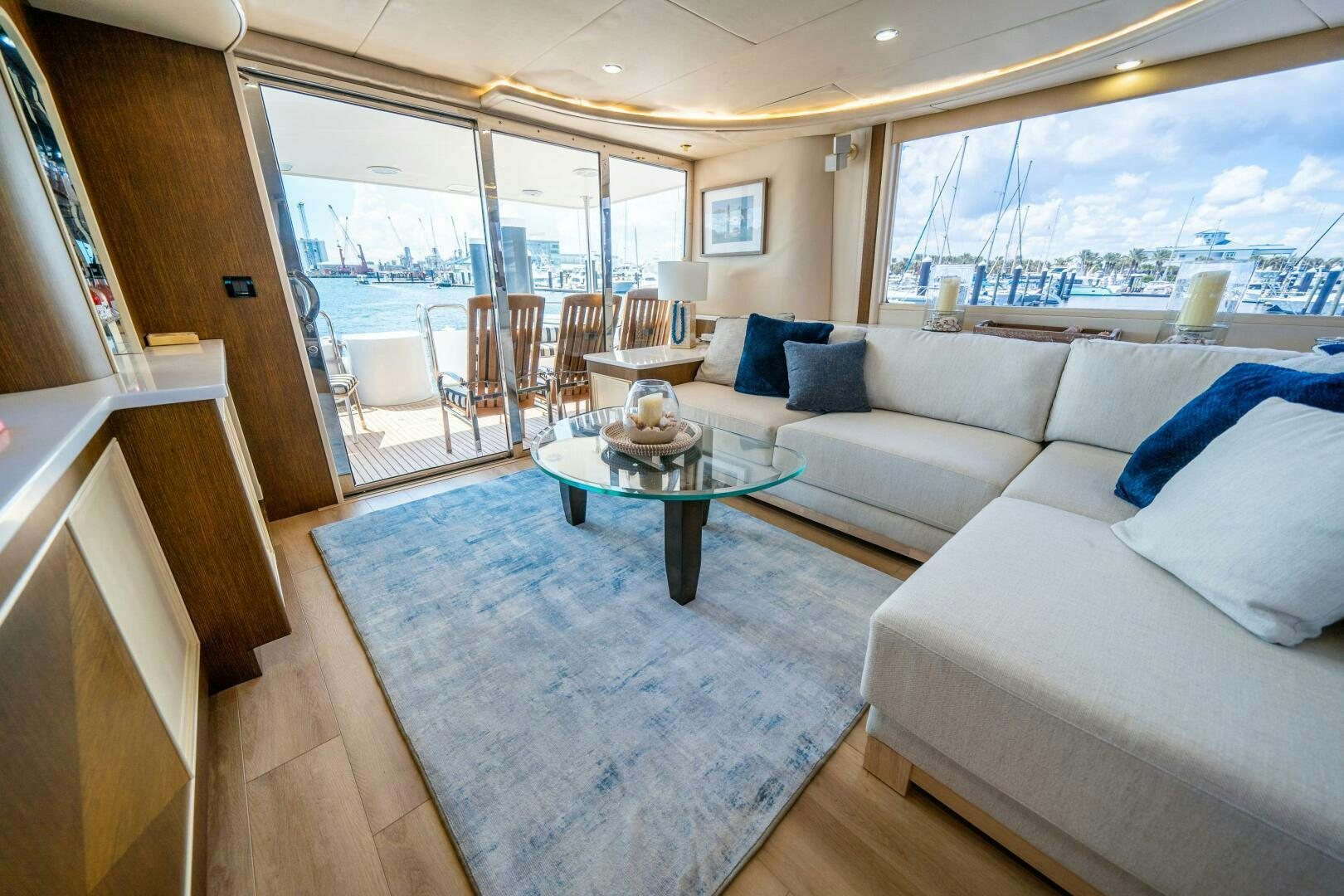 a living room with a large window aboard PRESTIGE WORLDWIDE Yacht for Sale