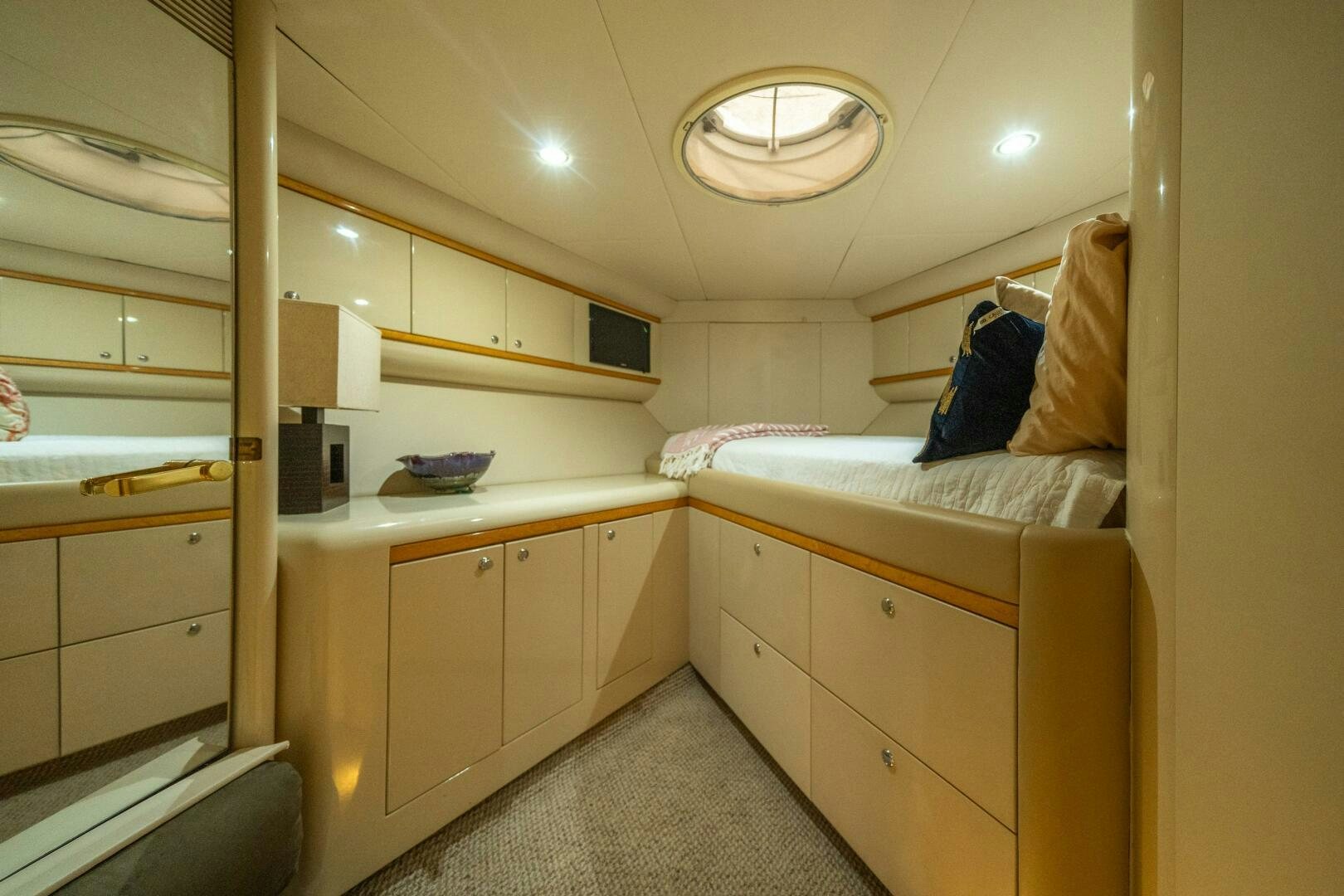 a small room with a bed and a desk aboard PRESTIGE WORLDWIDE Yacht for Sale