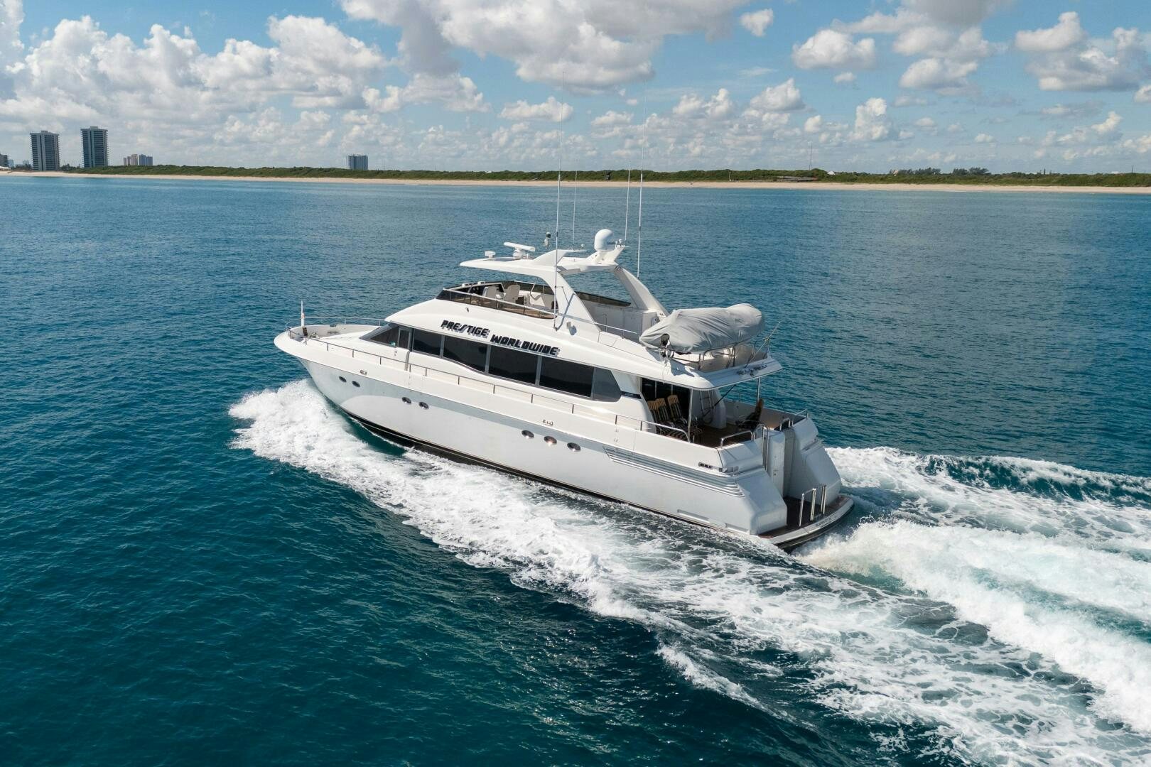 a boat on the water aboard PRESTIGE WORLDWIDE Yacht for Sale