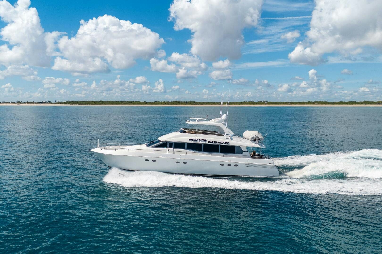 a white yacht on the water aboard PRESTIGE WORLDWIDE Yacht for Sale