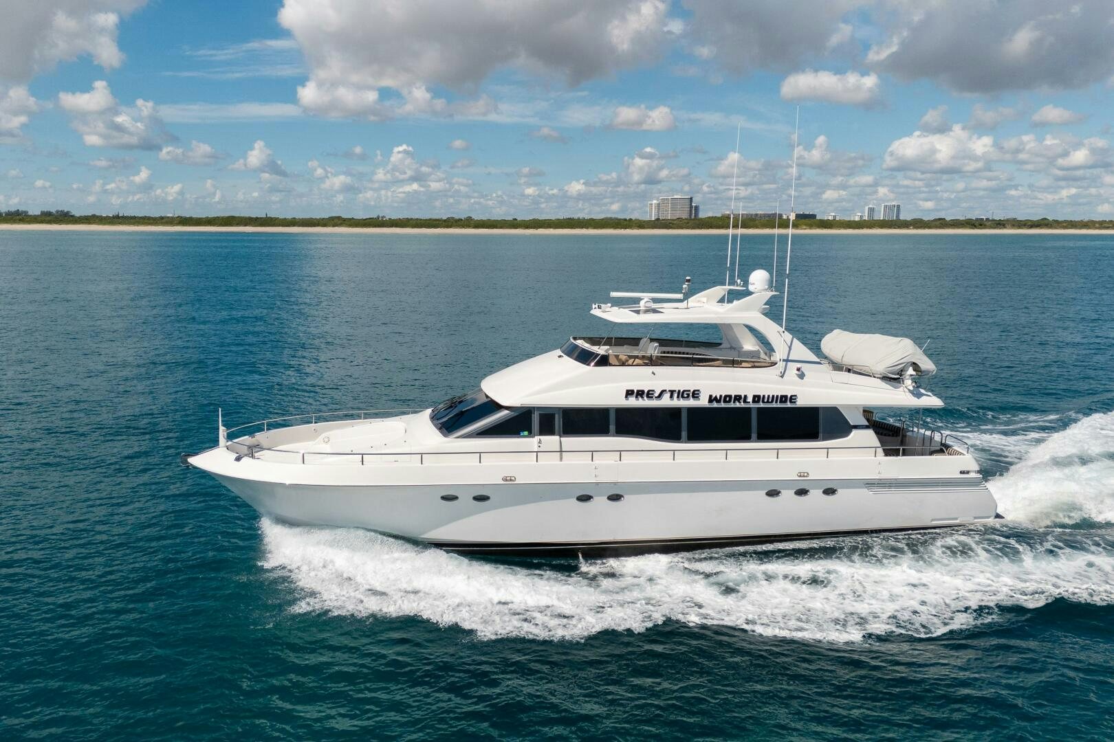 a white yacht on the water aboard PRESTIGE WORLDWIDE Yacht for Sale