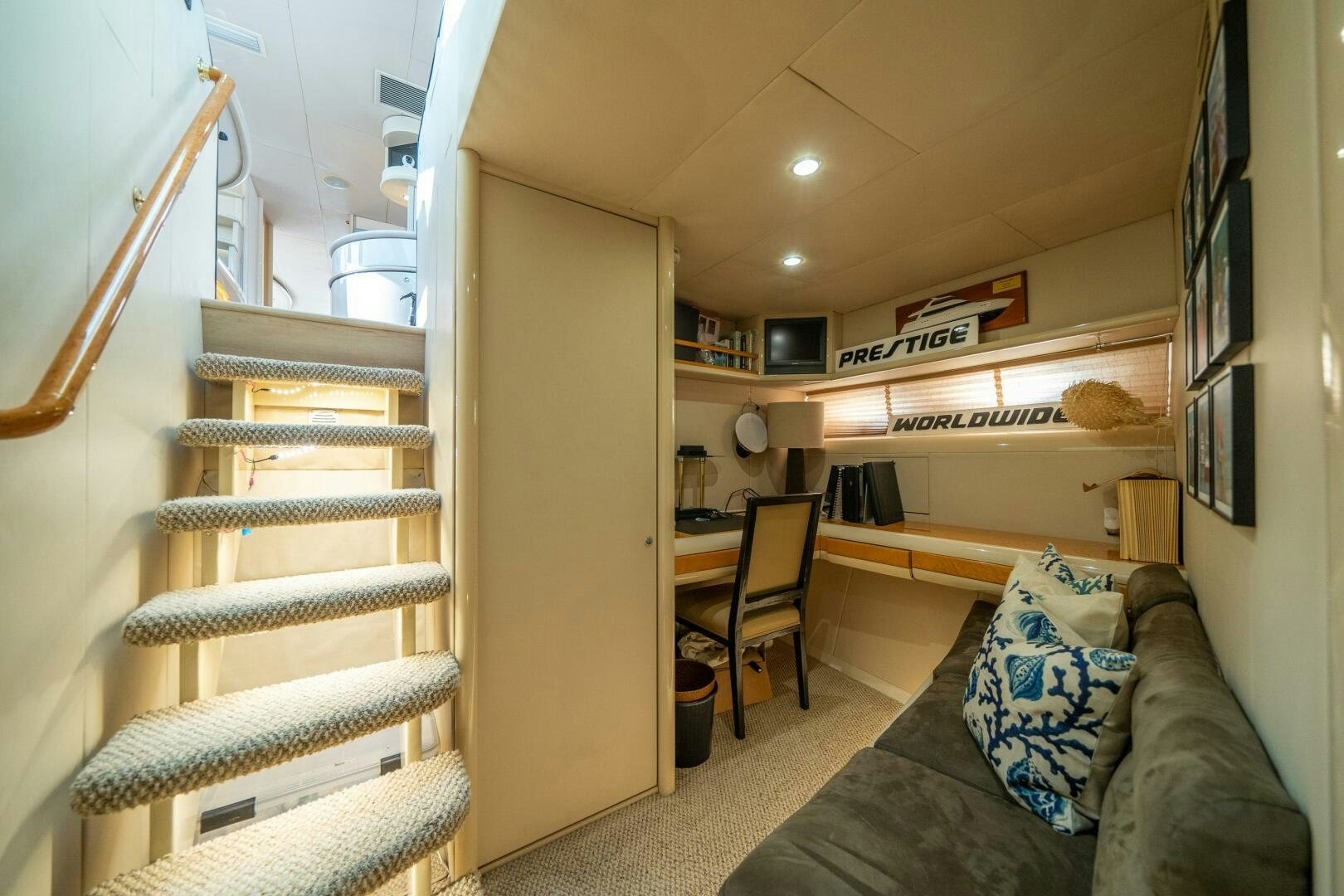 a room with a couch and a bed aboard PRESTIGE WORLDWIDE Yacht for Sale