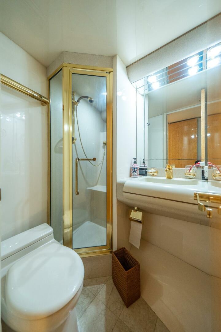 a bathroom with a glass shower aboard PRESTIGE WORLDWIDE Yacht for Sale