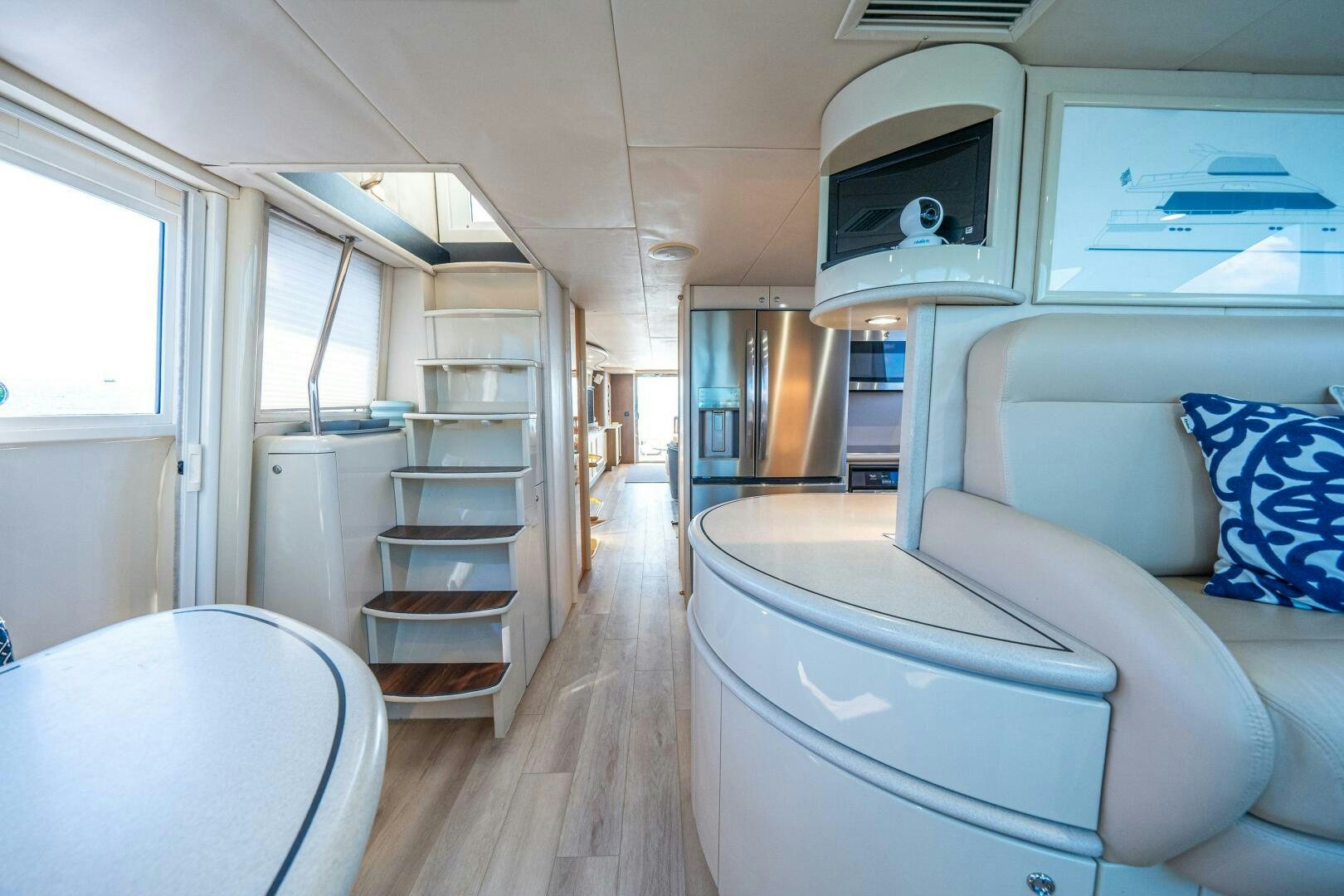 a room with a bed and a desk aboard PRESTIGE WORLDWIDE Yacht for Sale