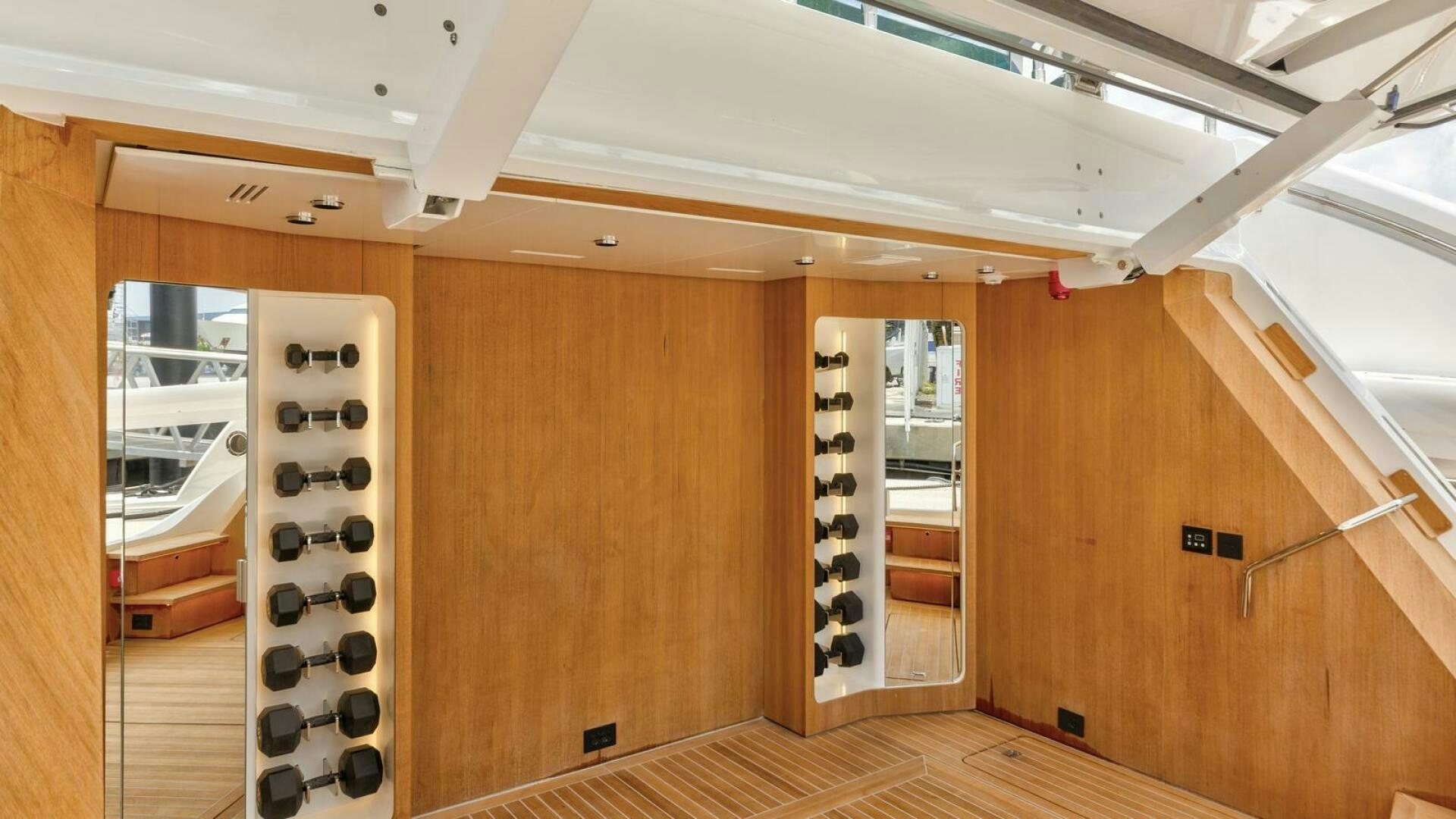 a room with wooden cabinets aboard OCEANIC 140 Yacht for Sale