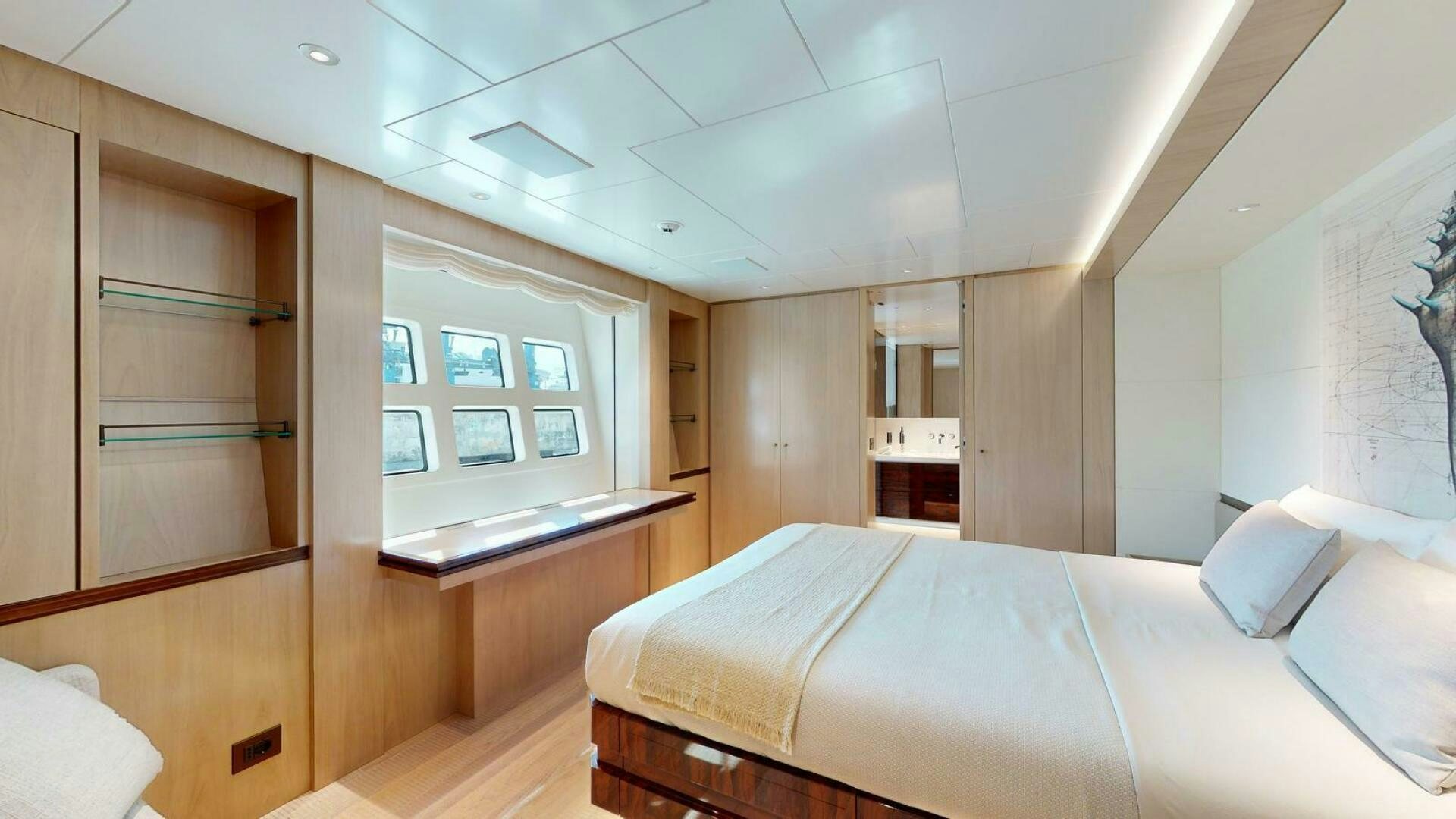 a room with a bed and a window aboard OCEANIC 140 Yacht for Sale