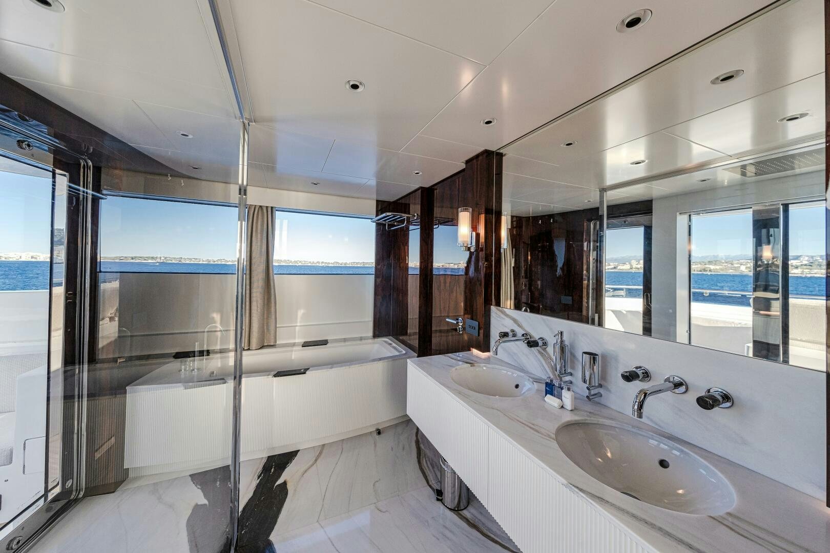 a bathroom with a large tub aboard OCEANIC 140 Yacht for Sale