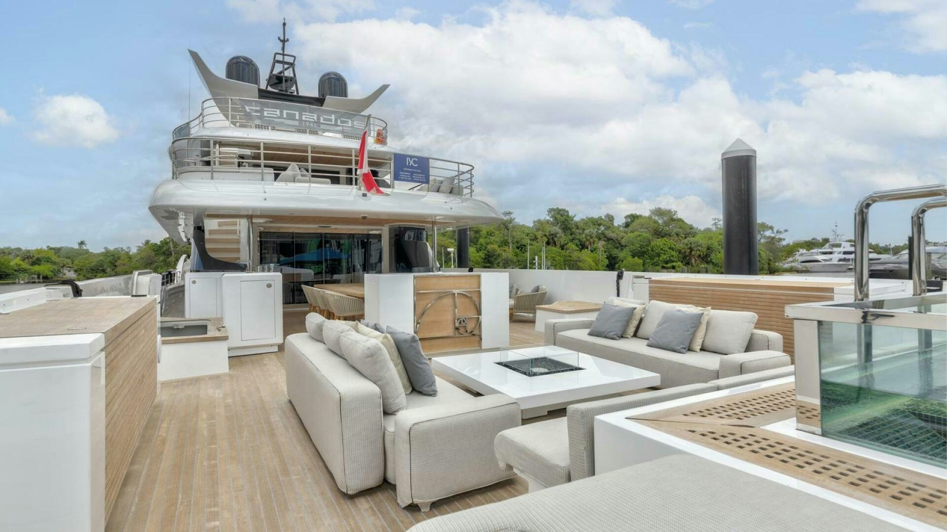 a living room with a large white boat on the roof aboard OCEANIC 140 Yacht for Sale