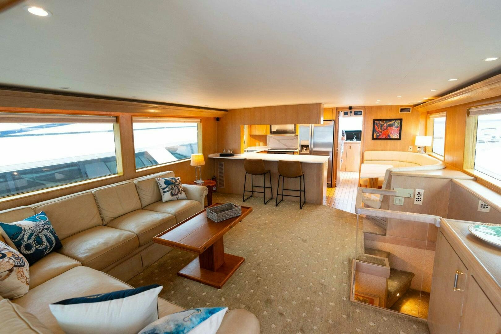 a living room with a couch and a table aboard KRAKEN Yacht for Sale