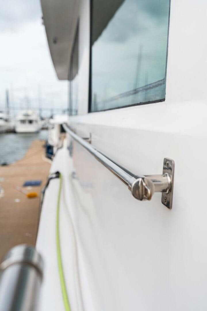 a window with a handle and a chain on a boat aboard KRAKEN Yacht for Sale