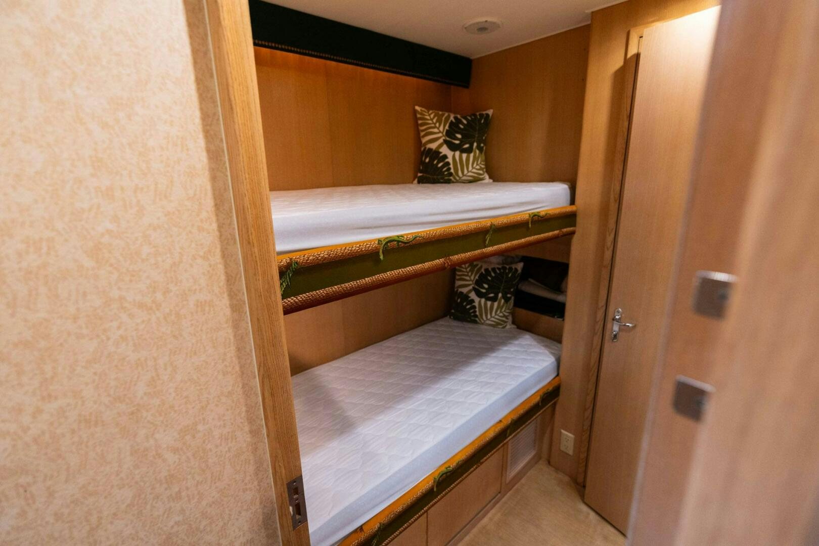 a room with two beds aboard KRAKEN Yacht for Sale