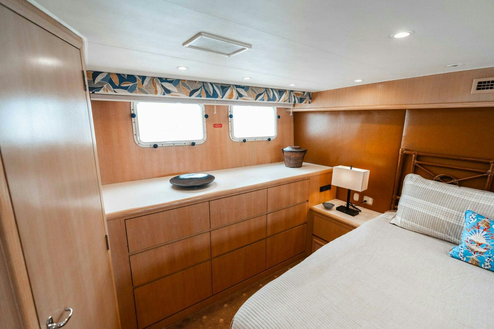a bedroom with a bed and a desk aboard KRAKEN Yacht for Sale
