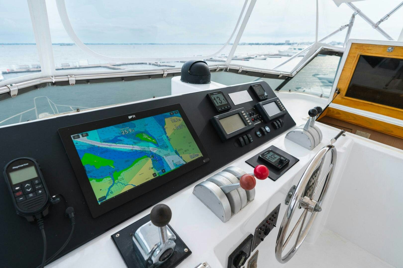 a control panel with a screen and buttons aboard KRAKEN Yacht for Sale