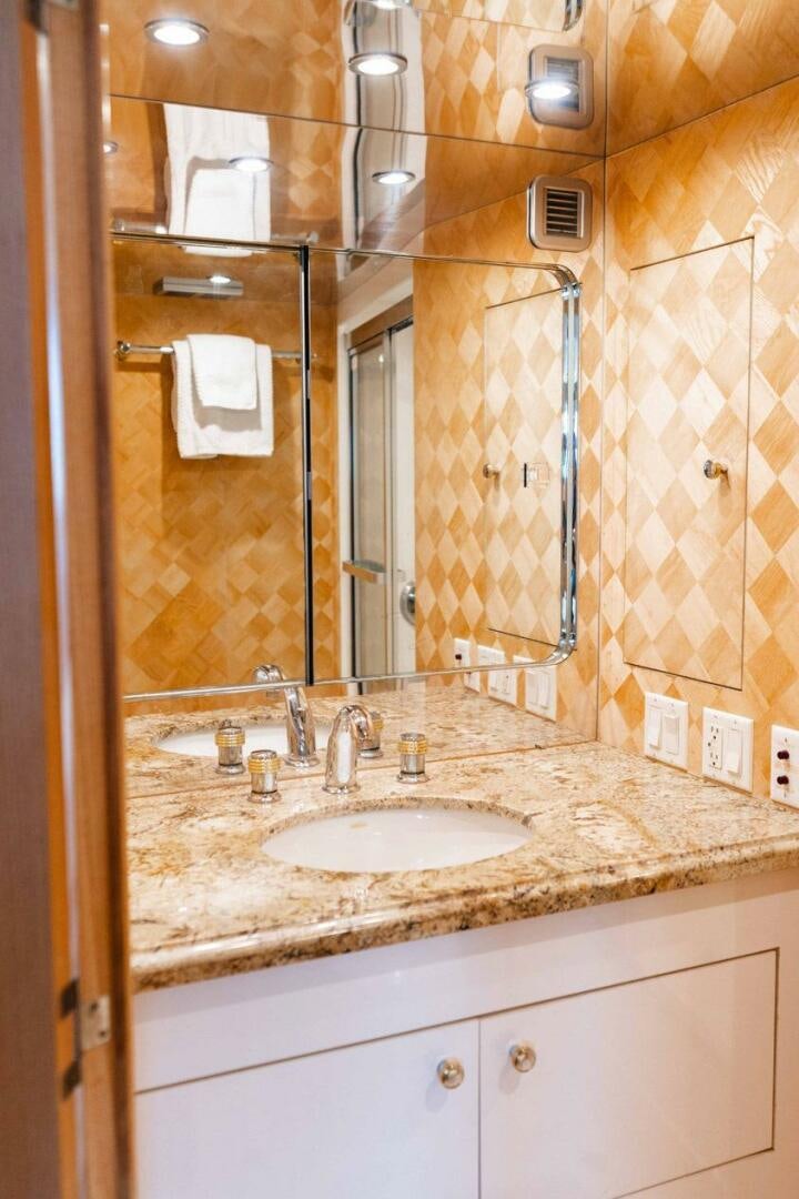 a bathroom with a large mirror aboard KRAKEN Yacht for Sale