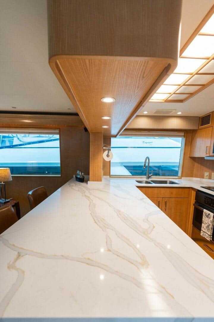 a large white table in a room aboard KRAKEN Yacht for Sale