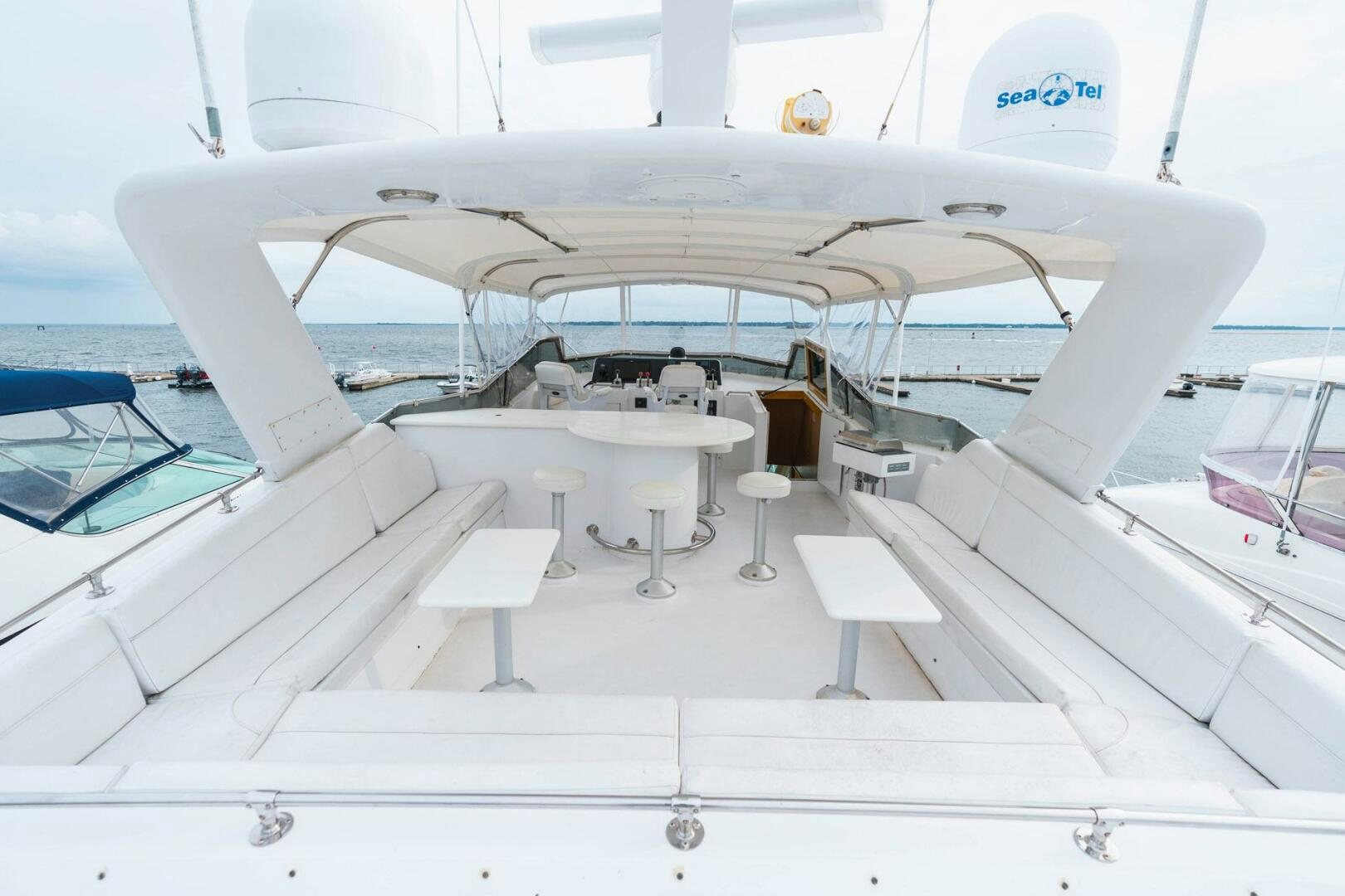 a white airplane with a group of seats around it aboard KRAKEN Yacht for Sale