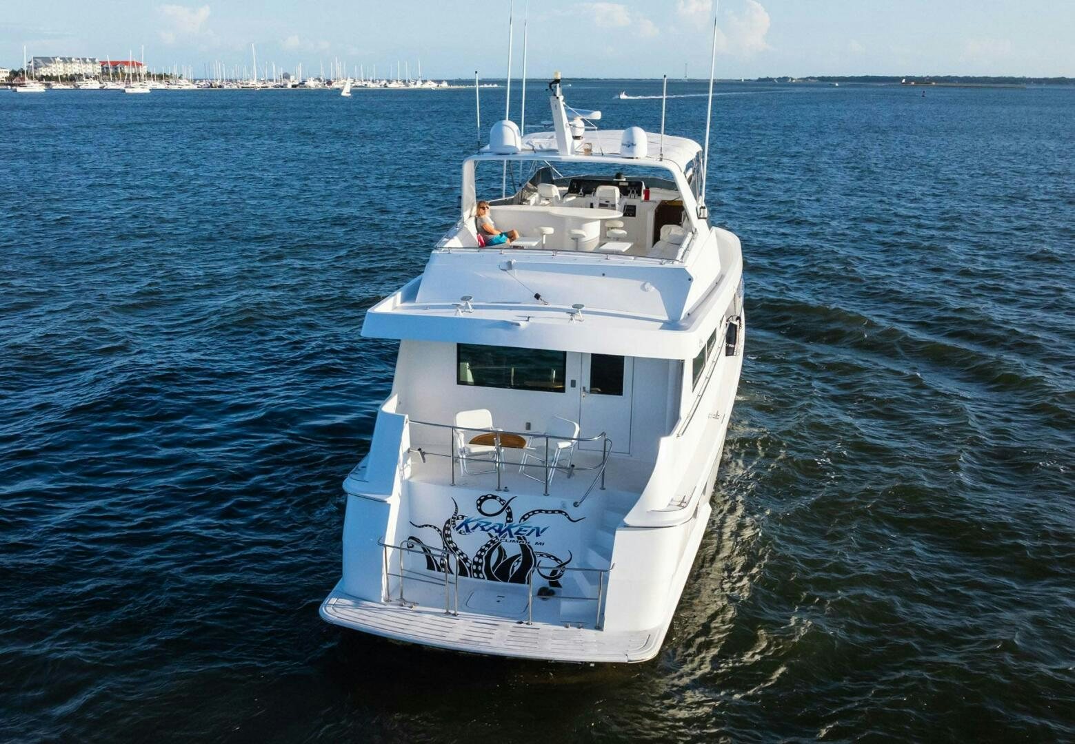 a white boat in the water aboard KRAKEN Yacht for Sale