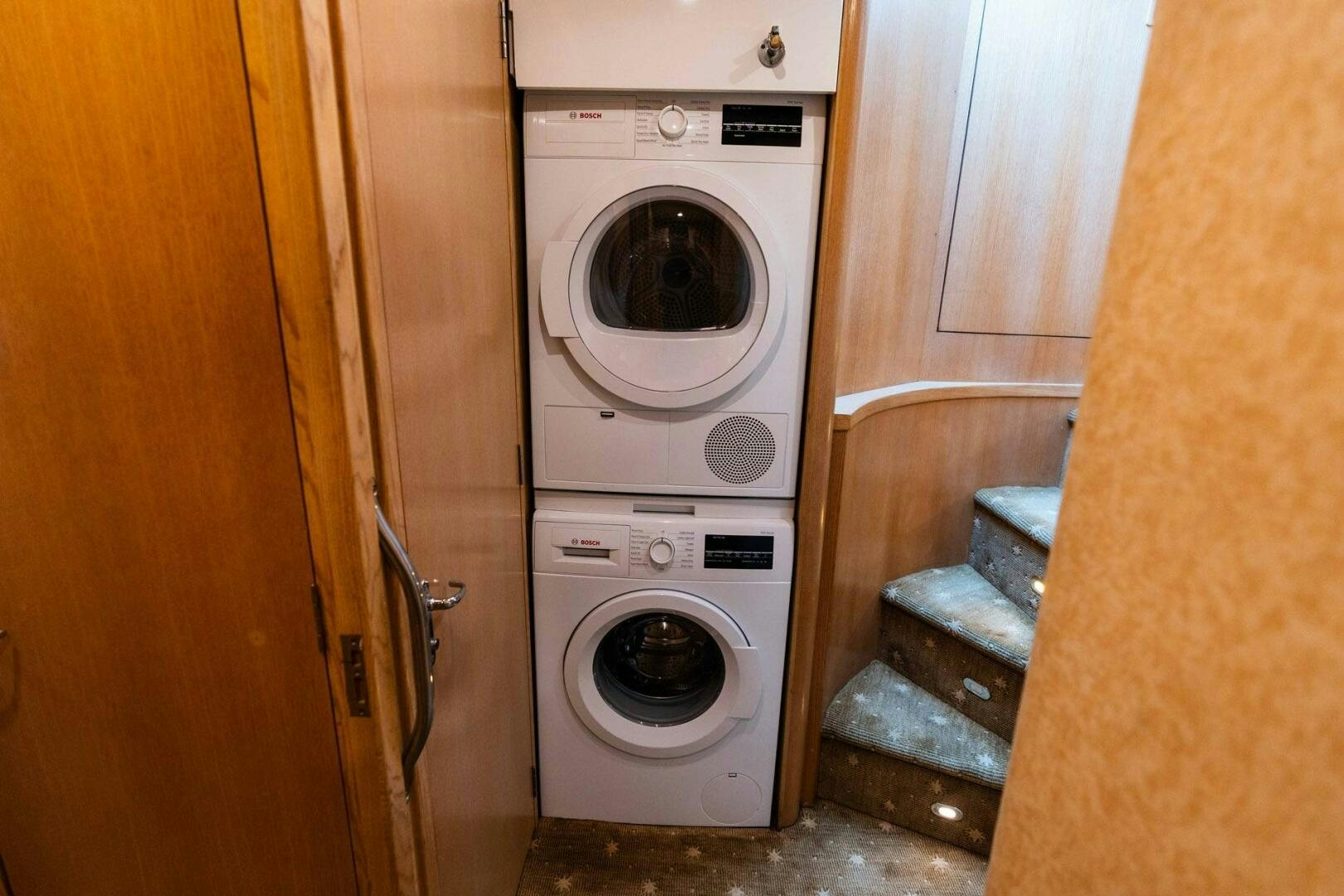 a washing machine in a room aboard KRAKEN Yacht for Sale