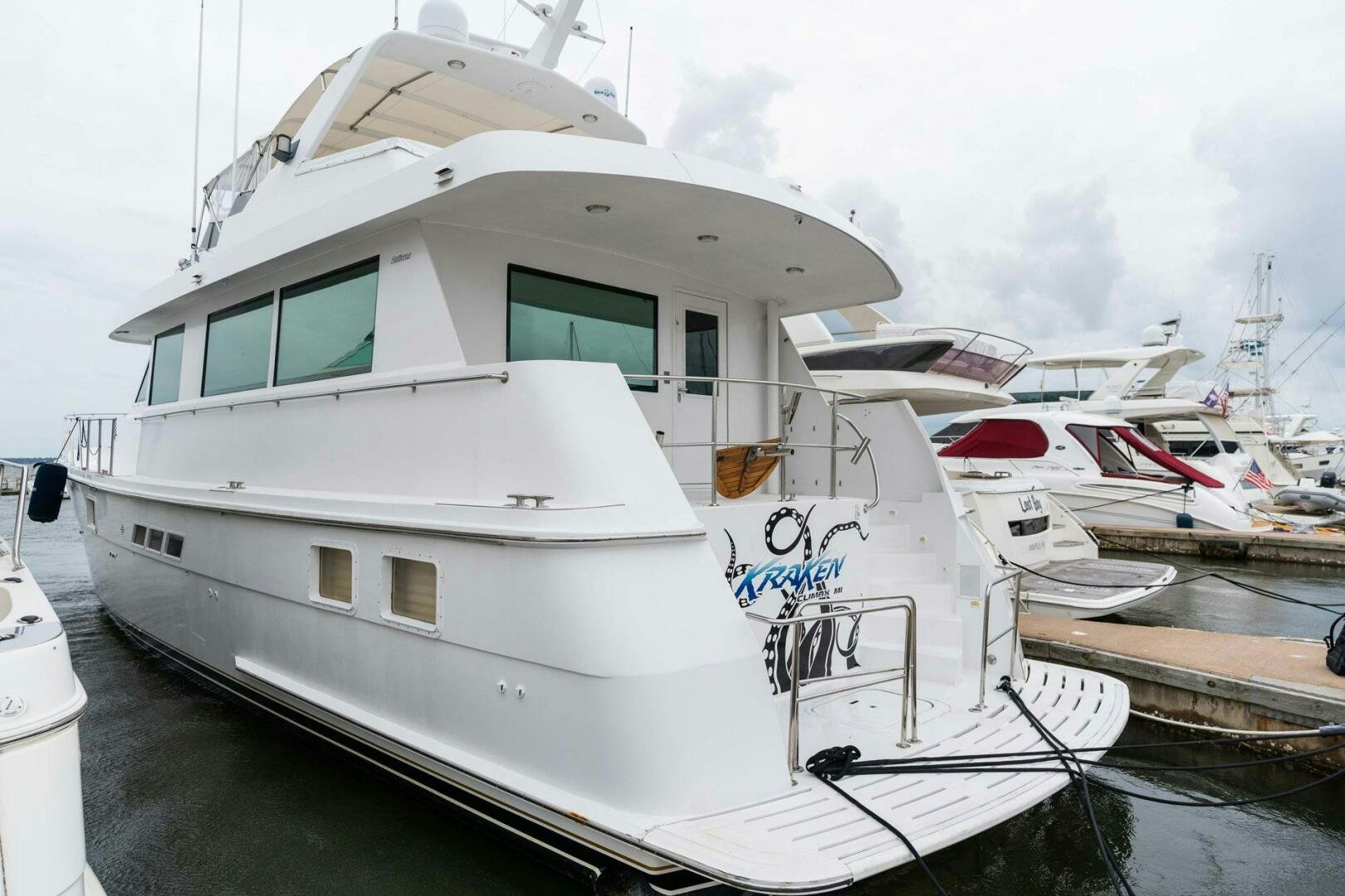 a white yacht docked aboard KRAKEN Yacht for Sale
