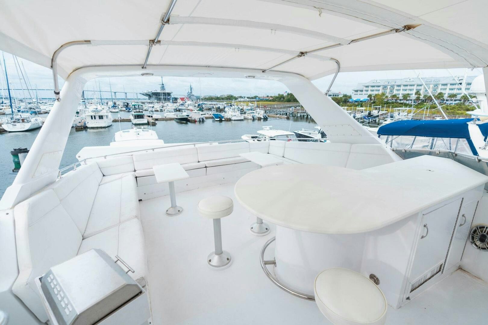 a white table with chairs on it aboard KRAKEN Yacht for Sale