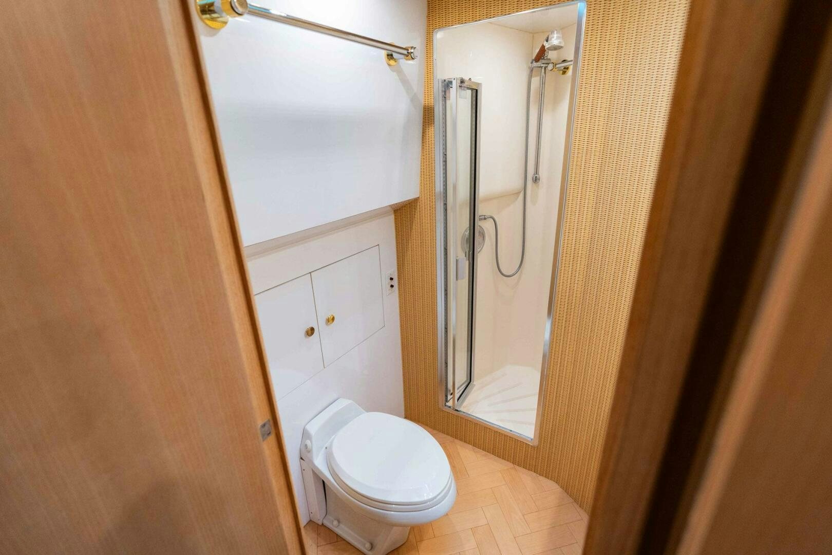 a bathroom with a toilet and a mirror aboard KRAKEN Yacht for Sale