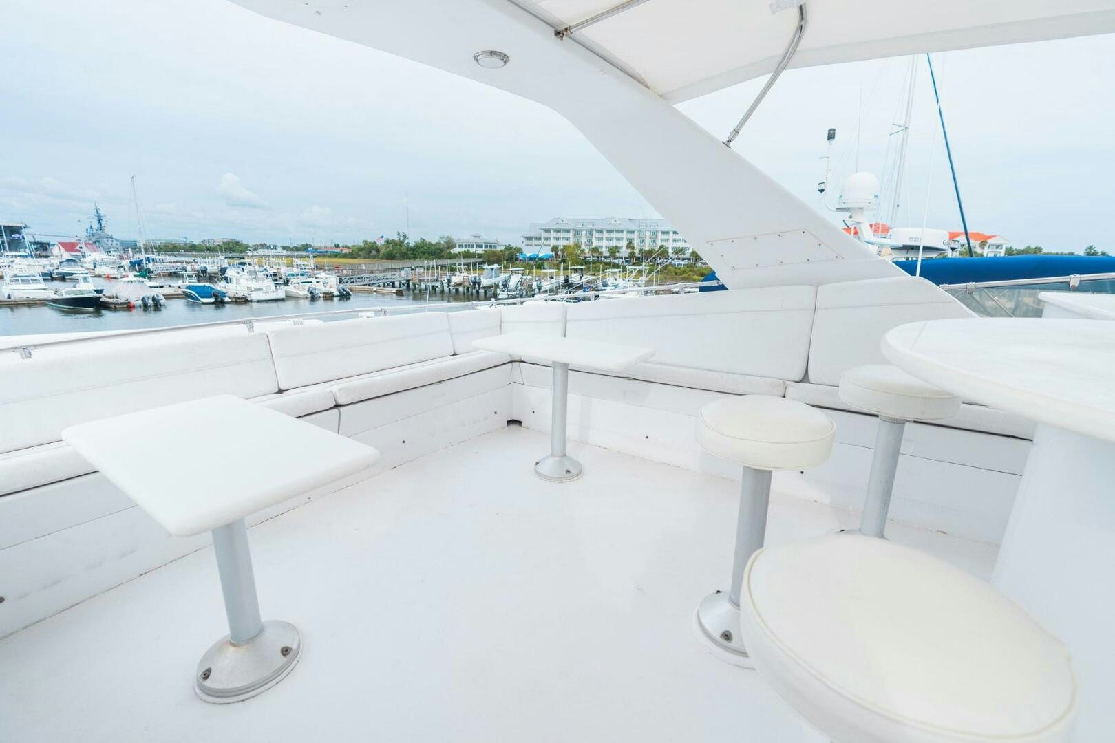 a group of white tables on a white surface aboard KRAKEN Yacht for Sale