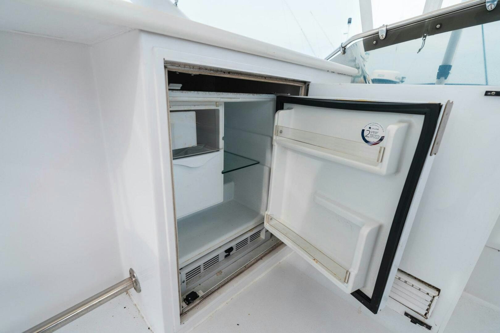 a white cabinet with drawers aboard KRAKEN Yacht for Sale
