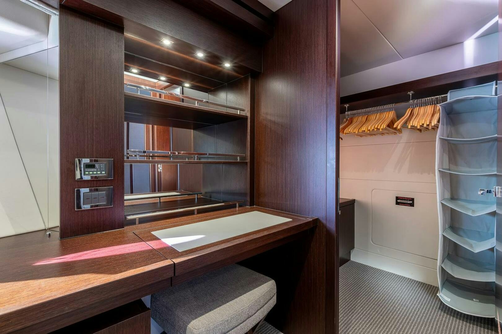 a room with a table and shelves aboard INSOMNIA Yacht for Sale