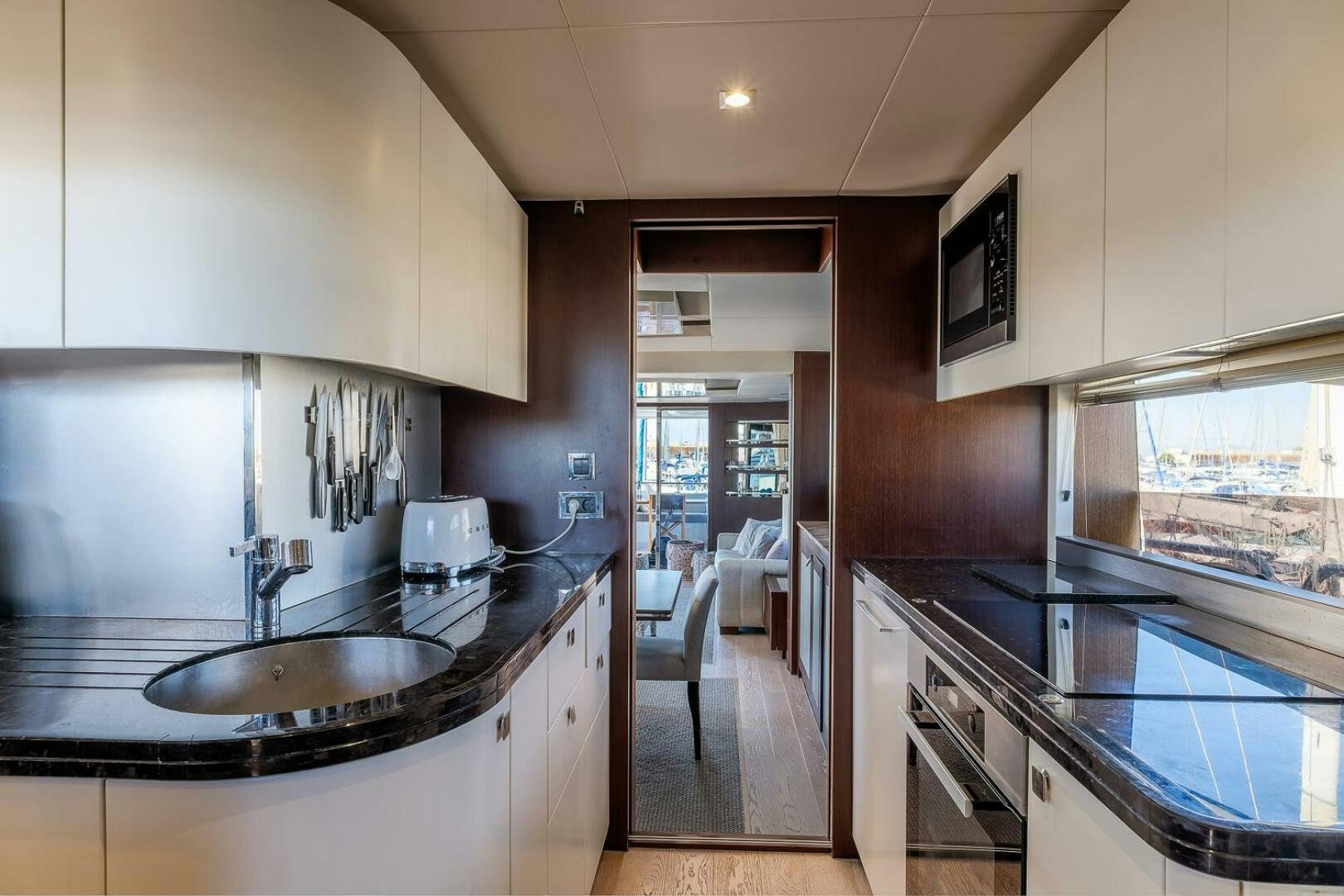 a kitchen with a sink and a stove aboard INSOMNIA Yacht for Sale