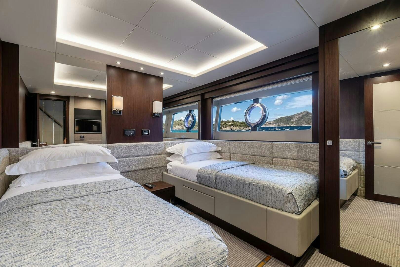 a room with two beds aboard INSOMNIA Yacht for Sale