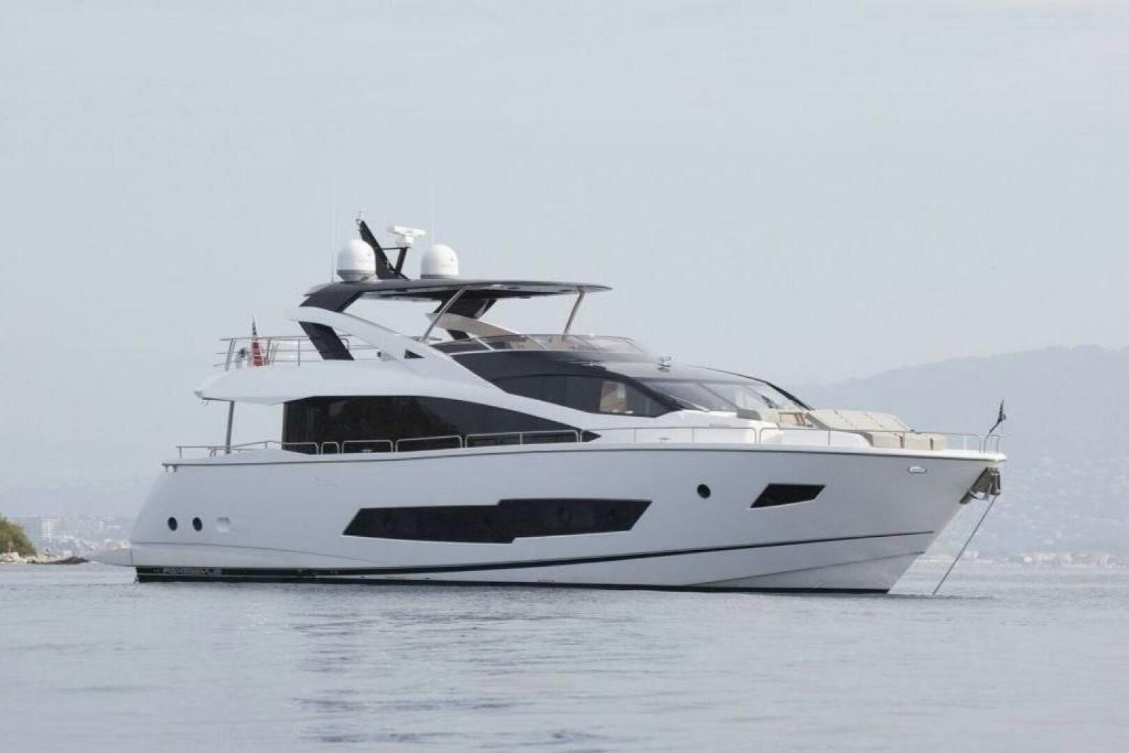 a white yacht on the water aboard INSOMNIA Yacht for Sale