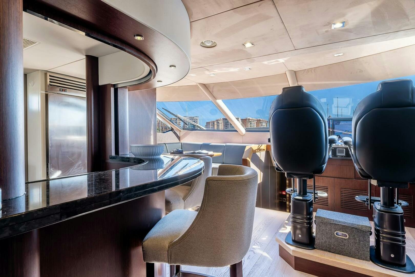 a room with a table and chairs aboard INSOMNIA Yacht for Sale