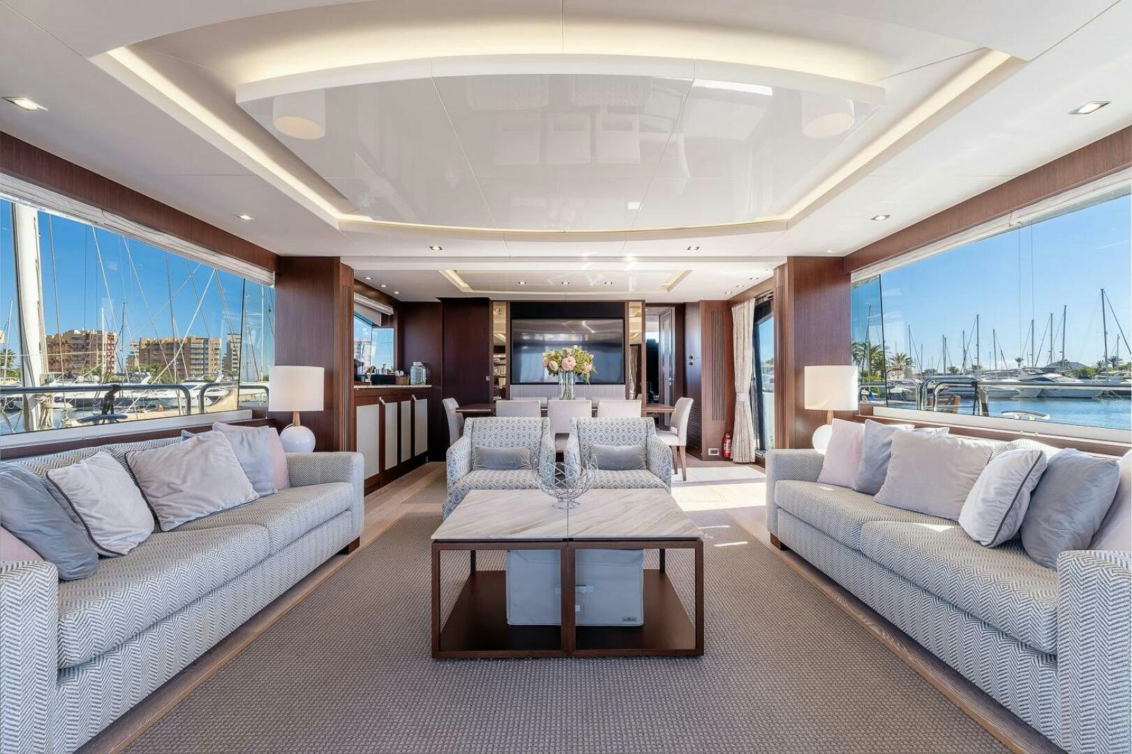 a living room with a couch and a table aboard INSOMNIA Yacht for Sale