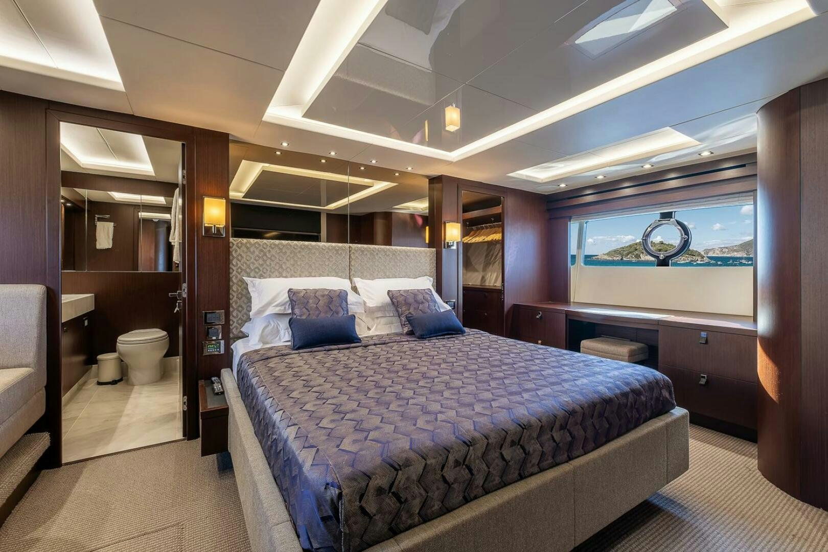 a bed in a room aboard INSOMNIA Yacht for Sale