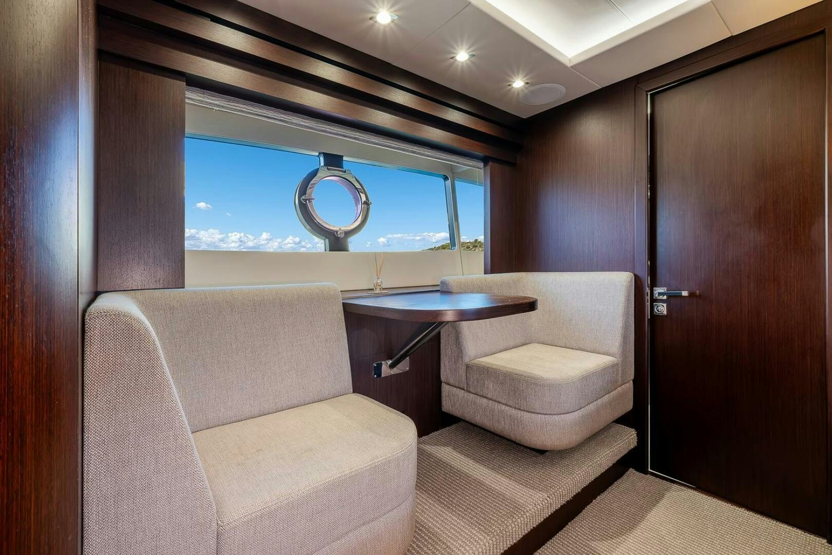 a room with a sink and a couch aboard INSOMNIA Yacht for Sale