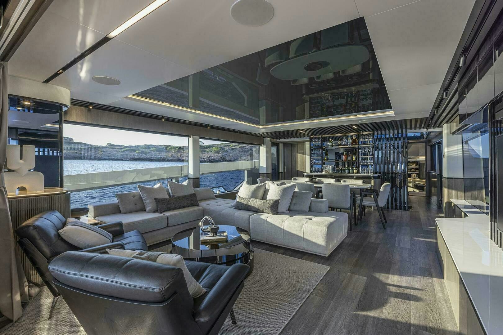 a living room with a large window aboard NONE Yacht for Sale