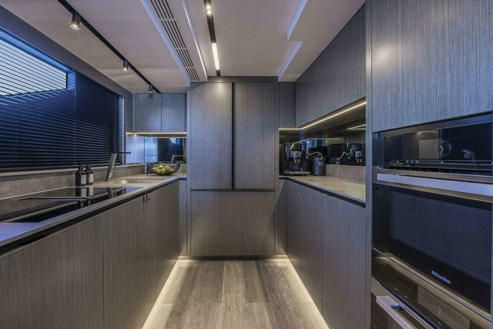 a kitchen with stainless steel appliances aboard NONE Yacht for Sale